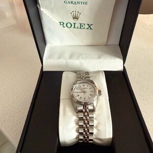 Very clean women’s Rolex 26mm no box but has papers.